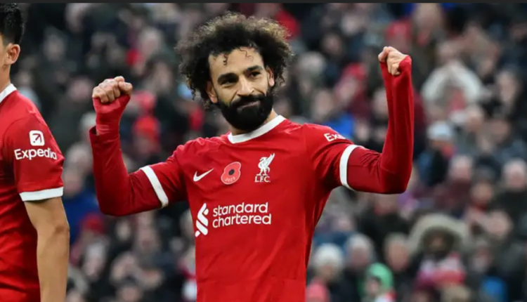 Mohamed Salah poses with commemorative Liverpool shirt alongside entire Reds squad after netting 200th goal for club against Crystal Palace