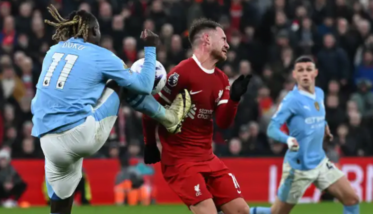 'Liverpool have been robbed' - Michael Oliver accused of Man City bias after failing to award penalty for Jeremy Doku's 'reckless' challenge on Alexis Mac Allister in stoppage time