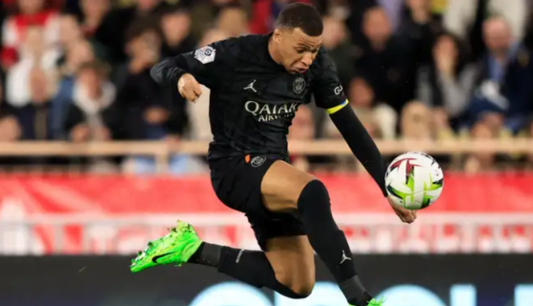 Kylian Mbappe’s rift with Luis Enrique continues! PSG forward subbed for second game in a row - at half-time of Monaco clash - and is pictured smiling in stands with his mum