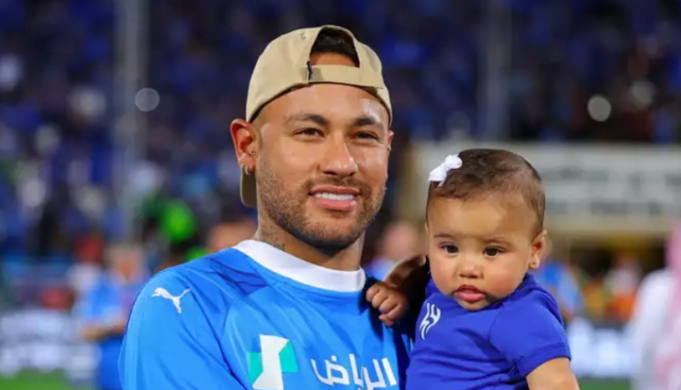 Al-Hilal are champions! Neymar celebrates on the field with his baby daughter after Saudi Pro League giants beat Cristiano Ronaldo's Al-Nassr to title